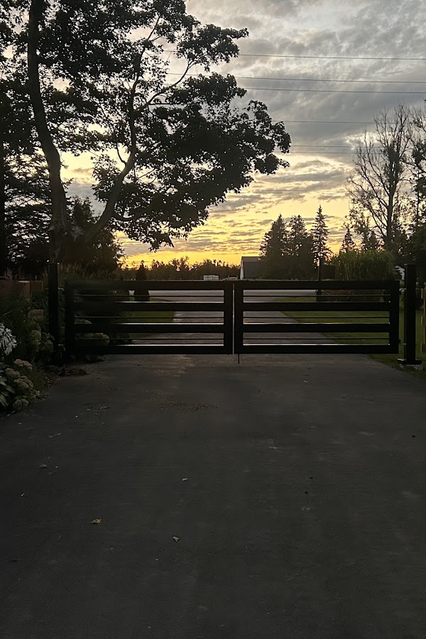 Sharon's installed black gate at sunset